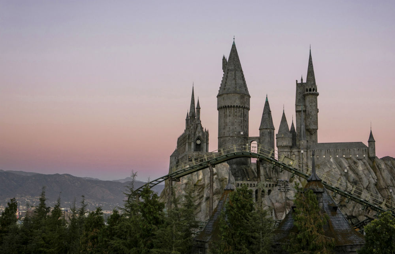 Flight of the Hippogriff rising above the treeline at The Wizarding World of Harry Potter.